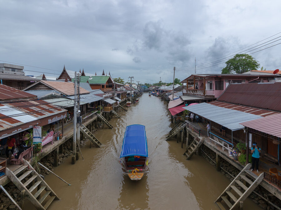 Wooden houses along the canal at Amphawa floating market