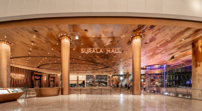 The Suralai Hall foyer at TRUE ICON HALL, with copper columns and a painted ceiling